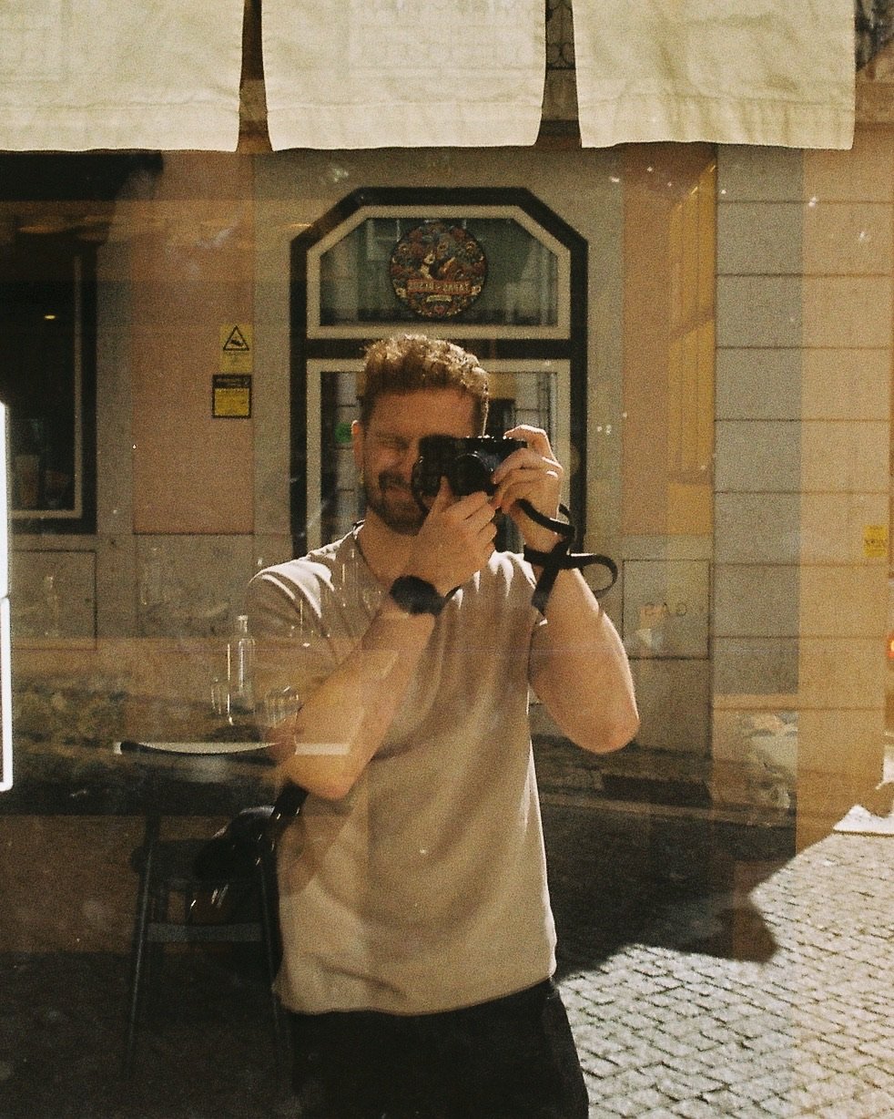 Fabian Rudolf with an analogue camera in front of his face